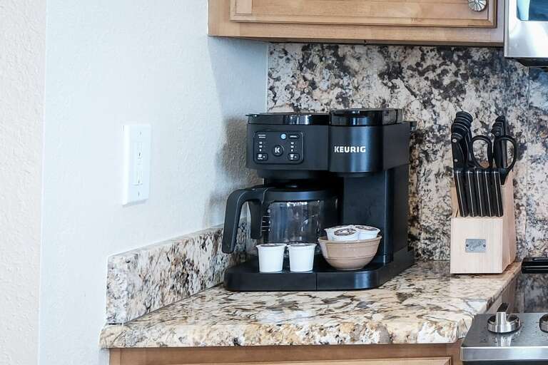 The kitchen is equipped with both a standard drip coffee maker and a Keurig, ensuring you can enjoy your favorite coffee during your stay