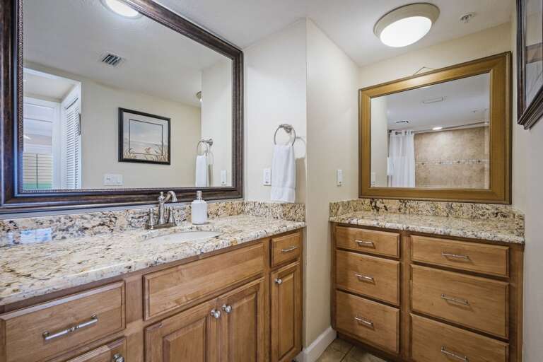 The master bathroom offers additional vanity space, providing extra room to get ready during your beach getaway