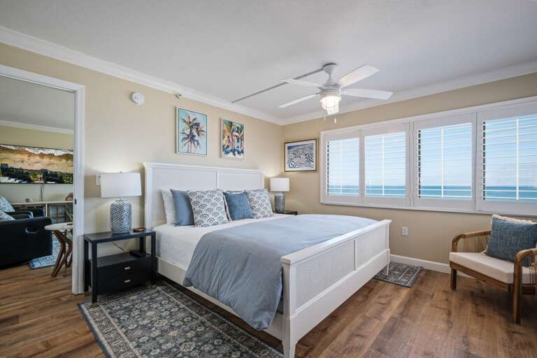 The oceanfront master bedroom offers a king bed, stunning beach views, and an ensuite bathroom for ultimate comfort