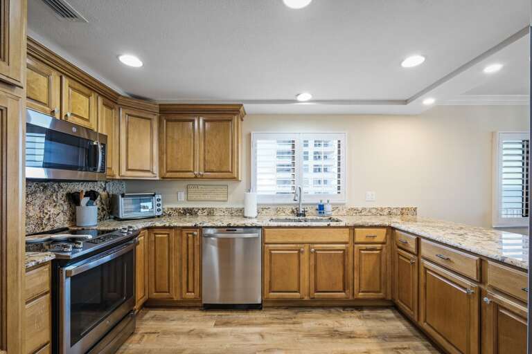 The updated, fully equipped kitchen is perfect for preparing meals while enjoying your beach getaway