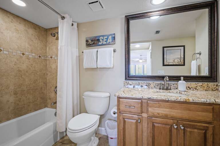 The updated master bathroom features a tub/shower combo