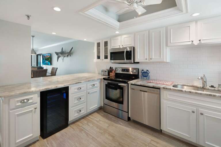 Cook in the kitchen while looking out towards the ocean.