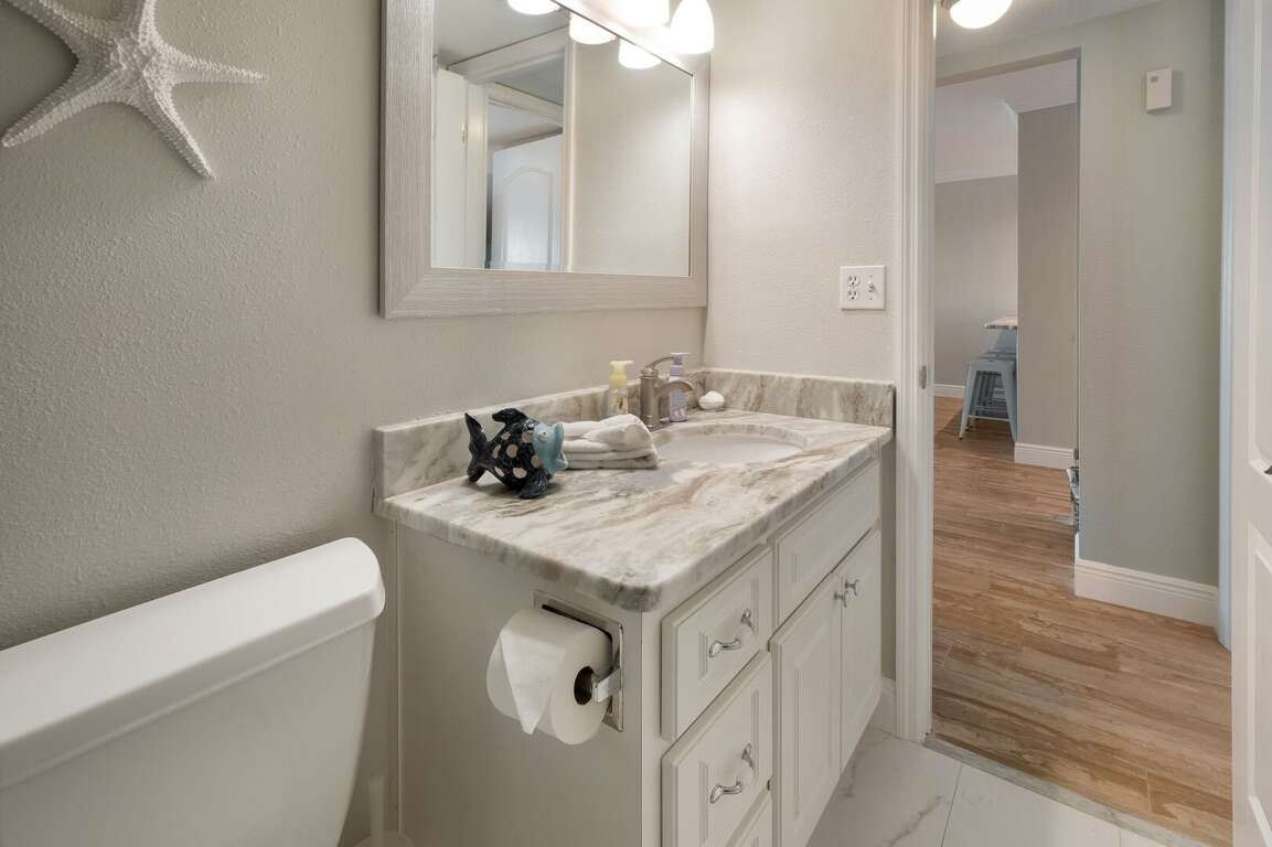 Guest bathroom has a large vanity. Guest bathroom has a large vanity.