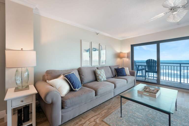 Spacious living room with beach views off the balcony. Spacious living room with beach views off the balcony.