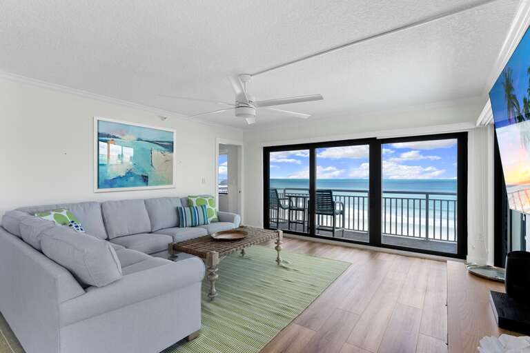 This corner condo boasts sweeping Atlantic Ocean and beach views from the direct oceanfront living room