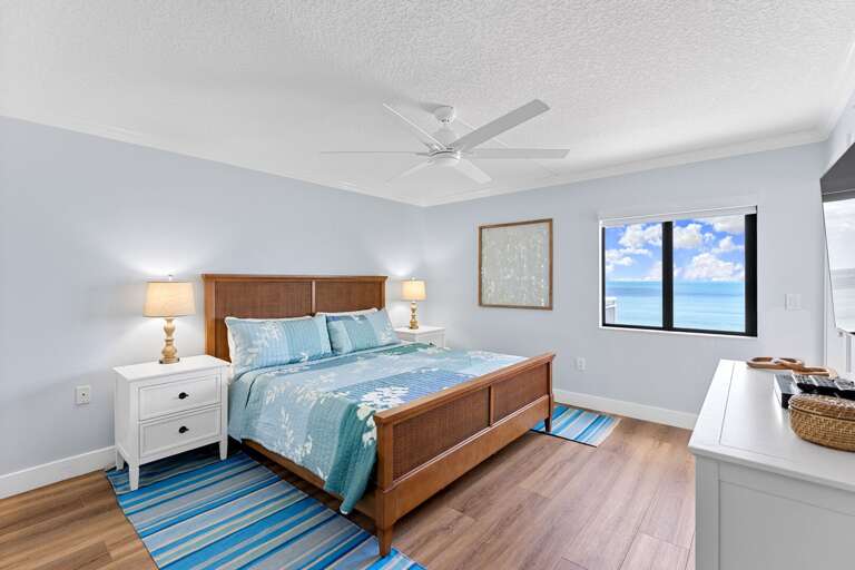 The direct oceanfront master bedroom offers a king bed and breathtaking views of the Atlantic Ocean
