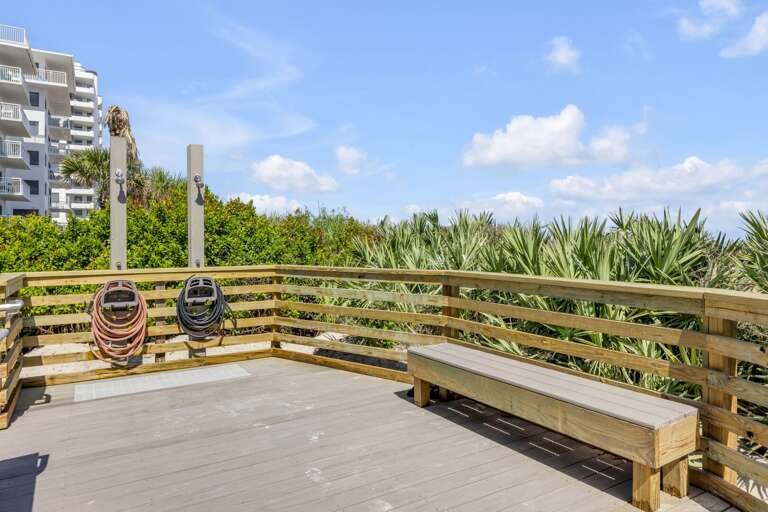 Shorehom by the Sea offers private beach access with a convenient boardwalk and a sand rinse station to wash off after a day on New Smyrna Beach