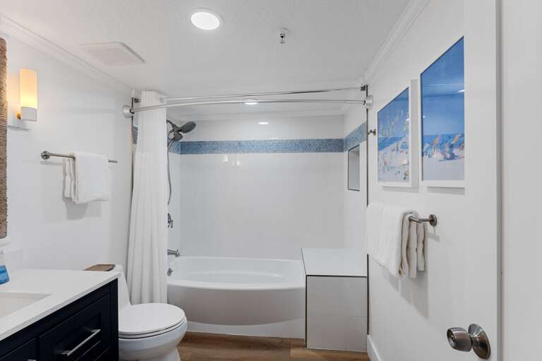 With an updated tub/shower combo and plush white spa towels, the master bathroom provides a spa-like atmosphere