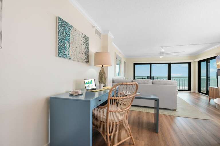 Need to work during your New Smyrna Beach getaway? This condo includes a dedicated workspace with a table, chair, and ocean views