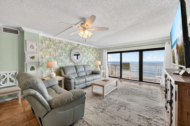 Enjoy the stunning oceanfront view from the comfortable reclining couch in the living room Enjoy the stunning oceanfront view from the comfortable reclining couch in the living room