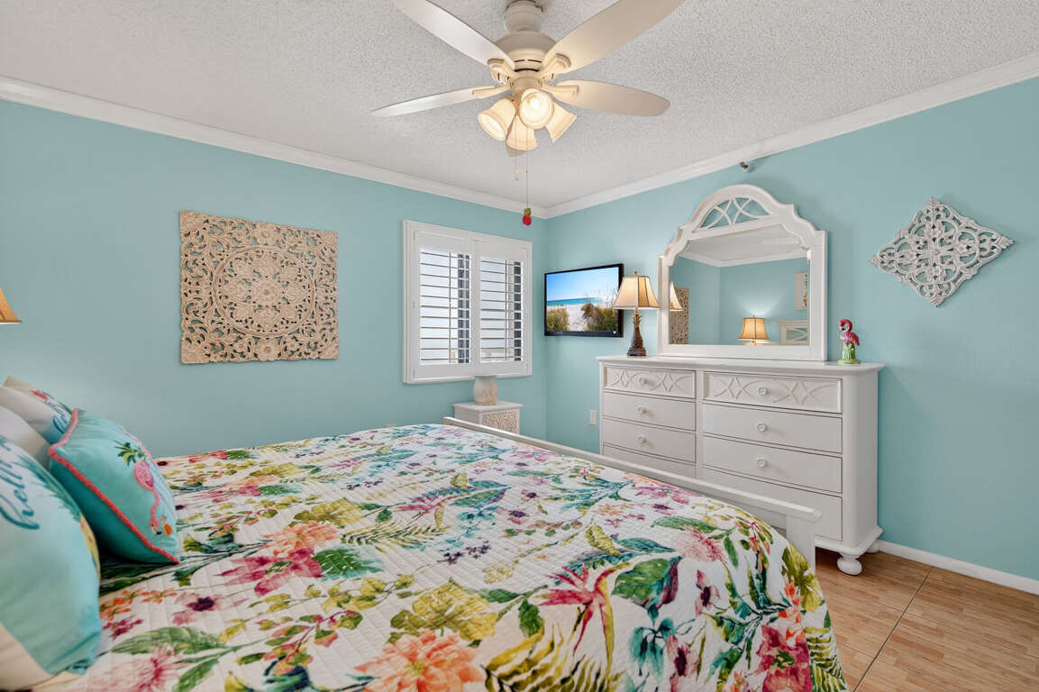 The master bedroom offers a king bed, a TV, and a view of New Smyrna Beach The master bedroom offers a king bed, a TV, and a view of New Smyrna Beach