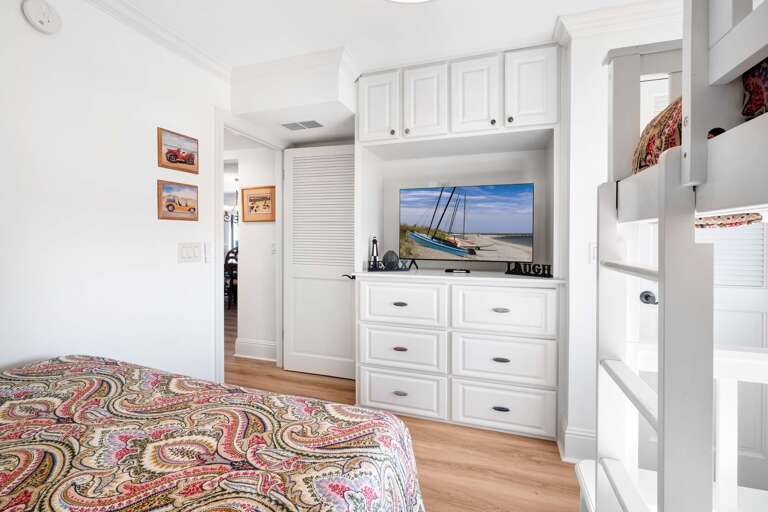 Each bedroom is equipped with its own TV, including the guest bedroom, ensuring everyone has their own space to relax and unwind