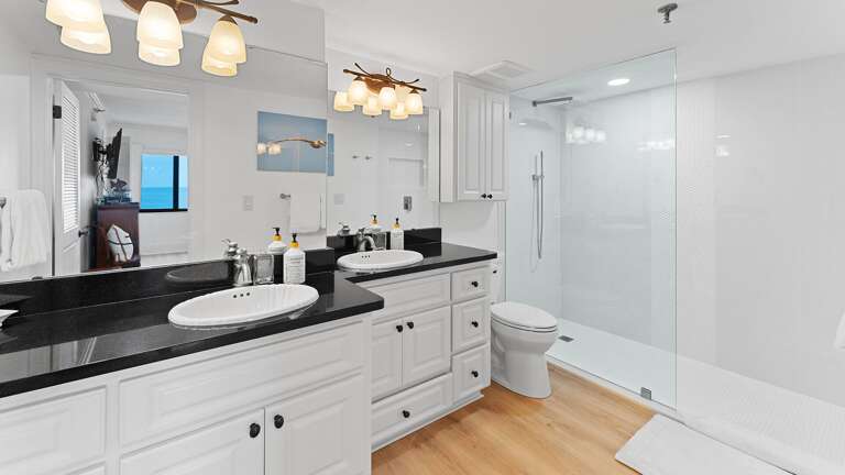 Catch a glimpse of the ocean's reflection in the master bathroom mirror Catch a glimpse of the ocean's reflection in the master bathroom mirror