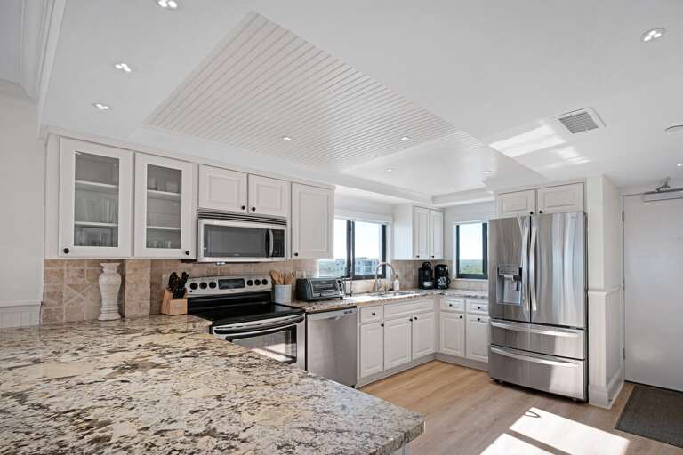 Cook in a fully equipped kitchen with the added bonus of a pool view from the window above the sink Cook in a fully equipped kitchen with the added bonus of a pool view from the window above the sink