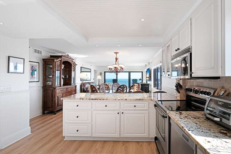 Cook with a view of the Atlantic Ocean, as the kitchen counter offers a stunning overlook of the beach and waves Cook with a view of the Atlantic Ocean, as the kitchen counter offers a stunning overlook of the beach and waves