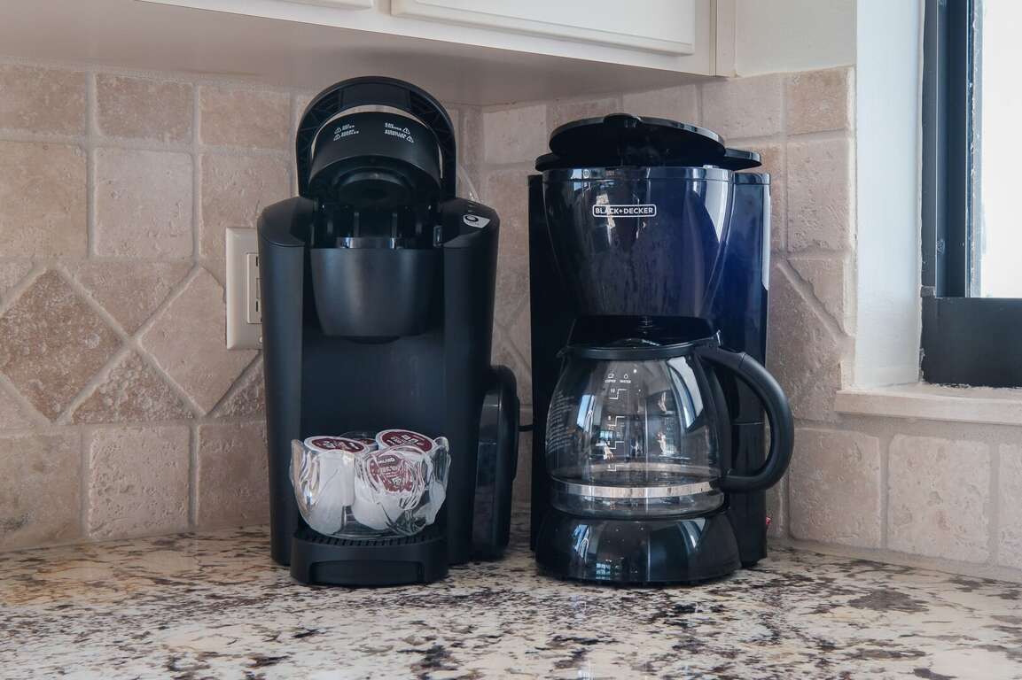 The kitchen is equipped with both a standard drip coffee maker and a Keurig, ensuring you have the perfect brew to start your day The kitchen is equipped with both a standard drip coffee maker and a Keurig, ensuring you have the perfect brew to start your day