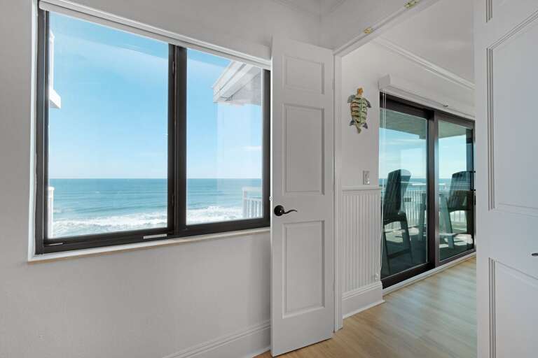 The master bedroom window provides a beautiful view of New Smyrna Beach, allowing you to wake up to the sights and sounds of the ocean The master bedroom window provides a beautiful view of New Smyrna Beach, allowing you to wake up to the sights and sounds of the ocean