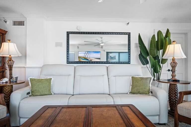 The oceanfront living room features a zero-gravity reclining sofa—your front-row seat for watching TV in total comfort The oceanfront living room features a zero-gravity reclining sofa—your front-row seat for watching TV in total comfort