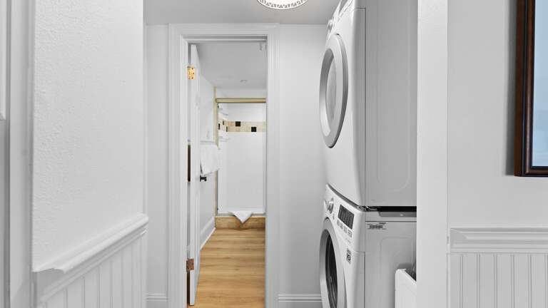 The washer and dryer are conveniently located near the guest bathroom The washer and dryer are conveniently located near the guest bathroom