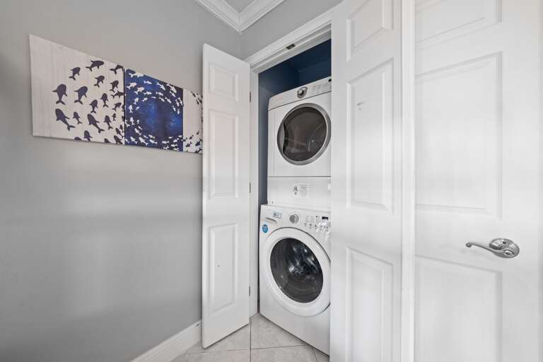 Full-sized washer and dryer located inside the condo