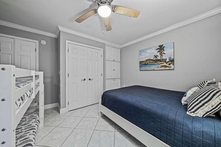 The guest bedroom TV can be conveniently tucked into the closet when not in use