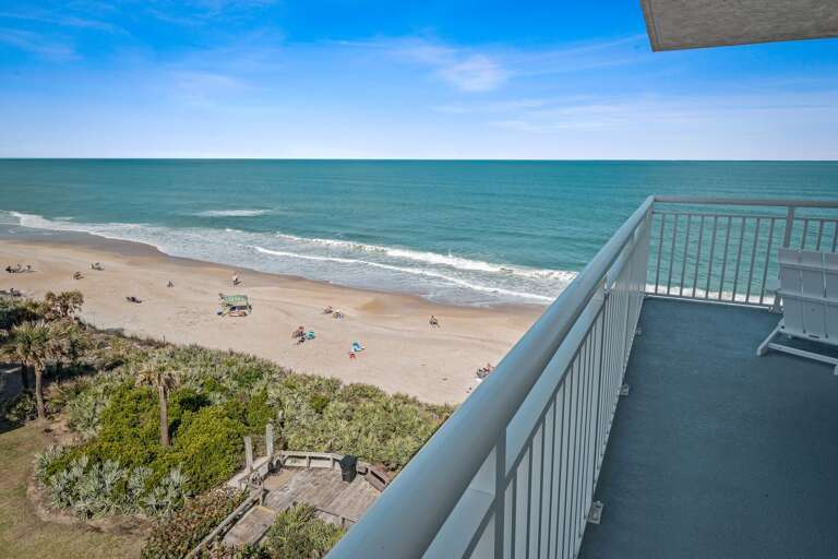 Large wrap-around balcony overlooking the Shorehom by the Sea pool and no-drive New Smyrna Beach