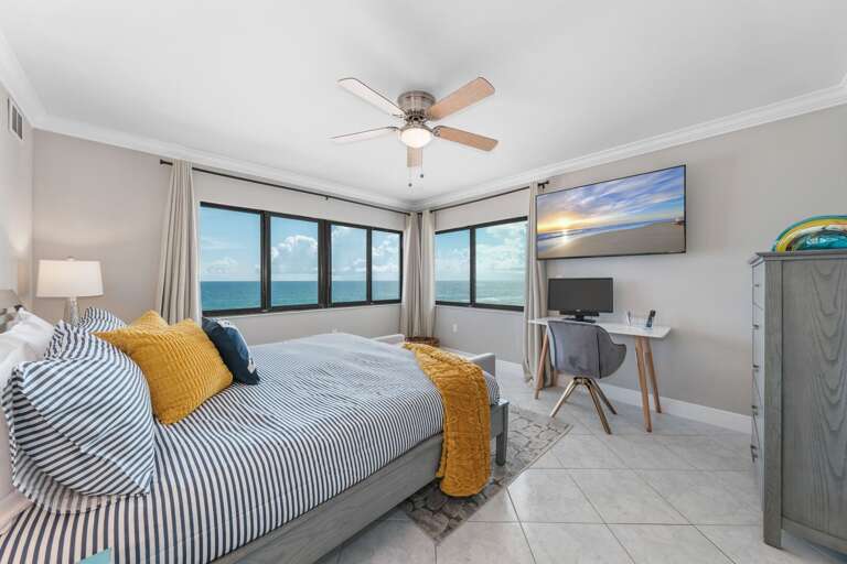 The oceanfront master bedroom has a king bed, large TV, desk with a USB cable, and a gorgeous Atlantic Ocean view The oceanfront master bedroom has a king bed, large TV, desk with a USB cable, and a gorgeous Atlantic Ocean view