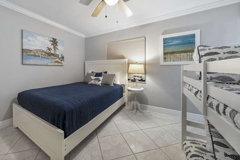 Queen bed and twin over full bunk bed in the guest bedroom