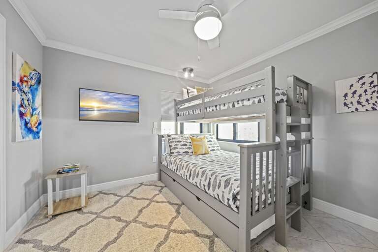 Twin over full bunk bed with a pull-out trundle in the guest bedroom