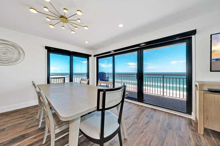 This corner condo provides unparalleled Atlantic Ocean views from the dining room, living room, kitchen, and wrap-around balcony