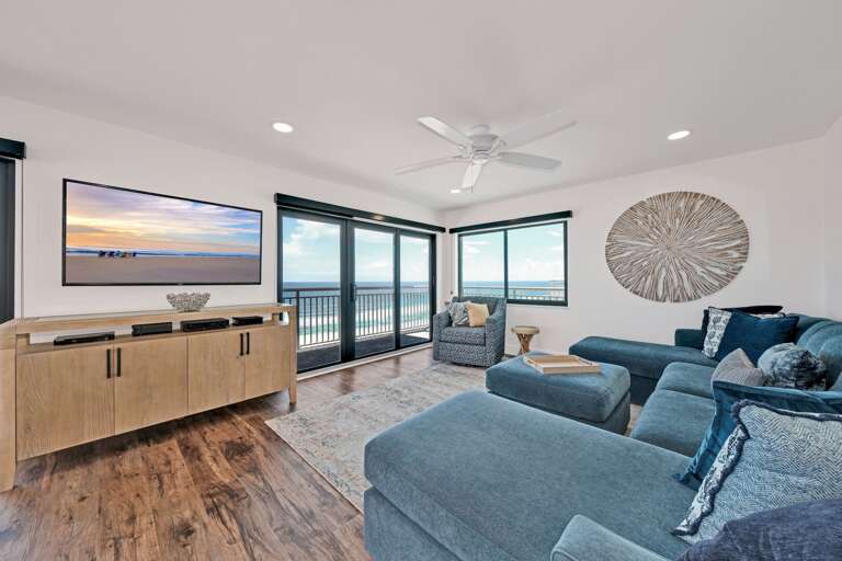 Enjoy stunning Atlantic Ocean and New Smyrna Beach views from the living room, dining room, and kitchen