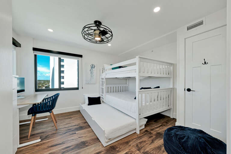 The second guest bedroom has a full over full bunk bed with a bonus trundle bed