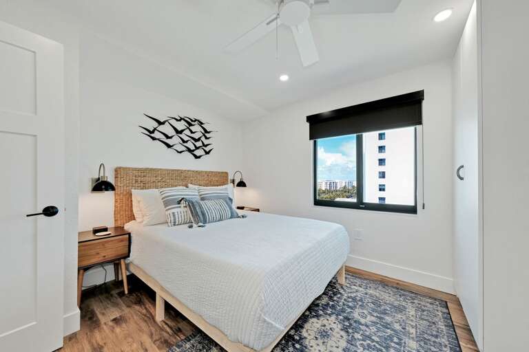 The guest bedroom has a queen bed and an Atlantic Ocean view