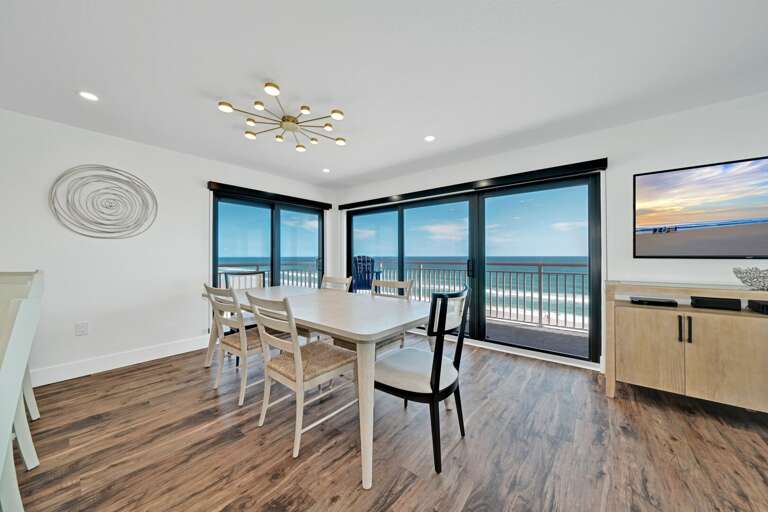 The oceanfront dining room table seats 6 and provides an unbelievable view