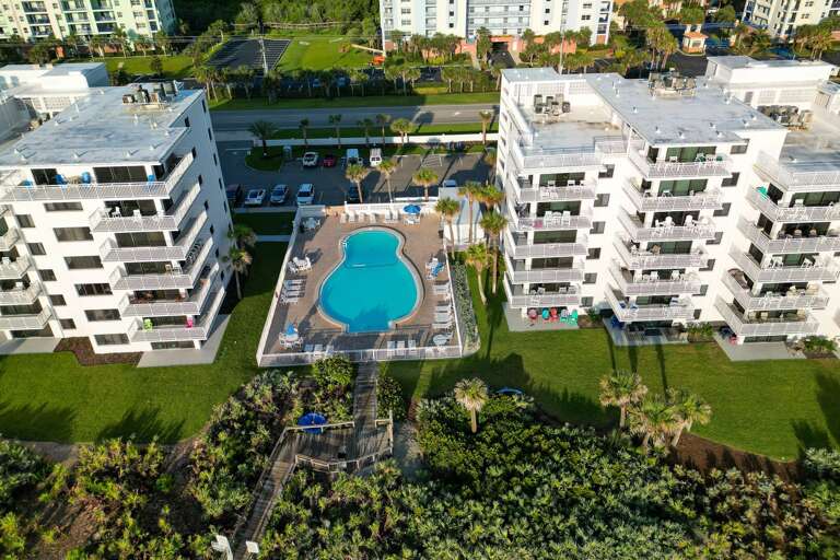 The Shorehom by the Sea North and South buildings are separated by a shared, beachfront pool