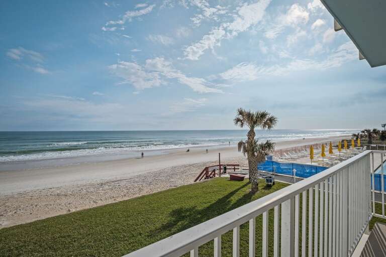 Breathtaking 2nd-floor balcony view overlooking the pristine shores of New Smyrna Beach