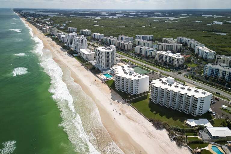 Smyrna Beach Club is located right on the sand of New Smyrna Beach, offering direct access to the beach