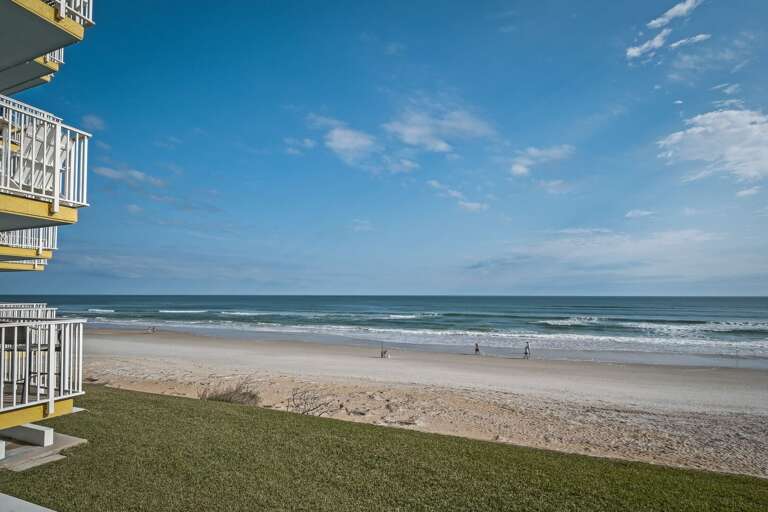 Enjoy a beautiful view of no-drive New Smyrna Beach right from the 2nd-floor balcony, offering a peaceful retreat by the Atlantic Ocean