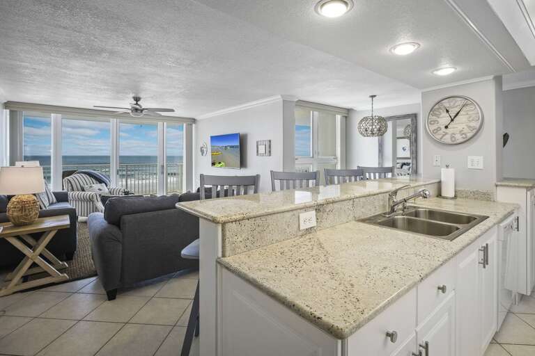 Enjoy stunning Atlantic Ocean views from the kitchen, living room, and dining room of this oceanfront condo in New Smyrna Beach