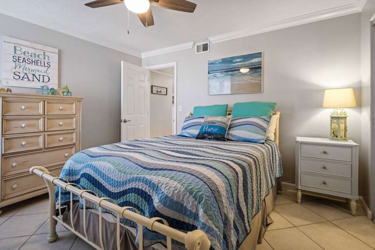 The guest bedroom also offers a comfortable queen bed