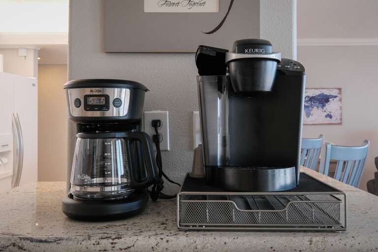The kitchen is equipped with both a Keurig coffee maker and a standard drip coffee maker