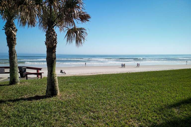 The wide, flat New Smyrna Beach is the perfect spot for a relaxing beach walk, offering scenic views and a peaceful atmosphere right outside your door