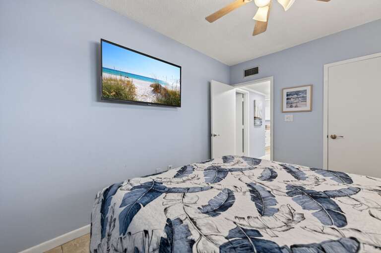 Catch your favorite shows on the TV from the comfortable queen bed in this inviting guest room. Catch your favorite shows on the TV from the comfortable queen bed in this inviting guest room.