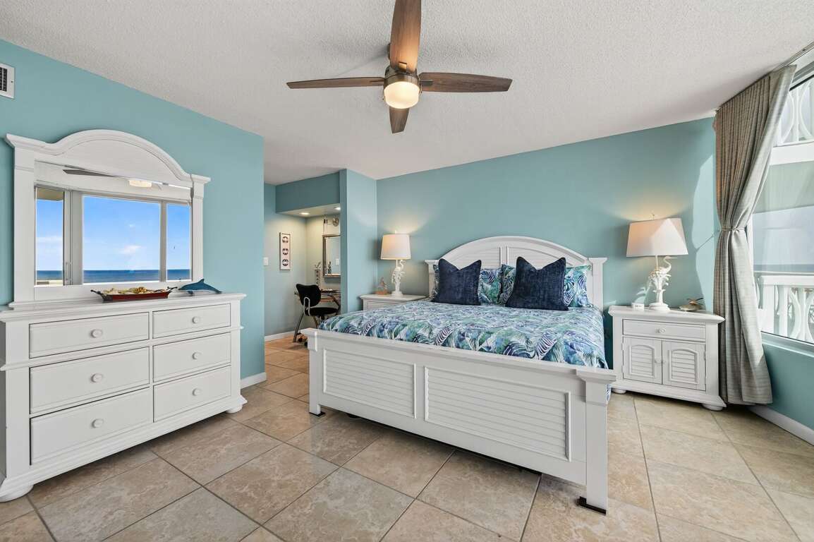 Drift off in the master bedroom's king bed, surrounded by coastal décor and sweeping oceanfront views. Drift off in the master bedroom's king bed, surrounded by coastal décor and sweeping oceanfront views.