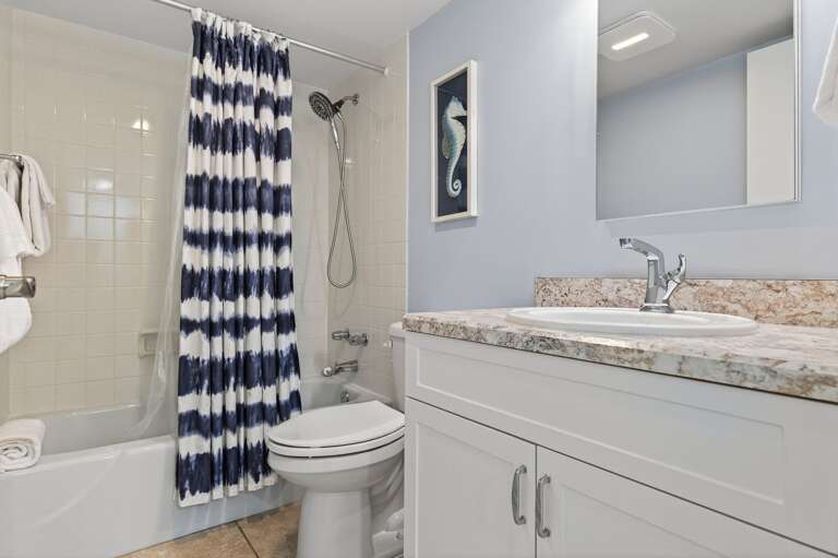 Relax and refresh in the elegant master bath featuring a tub-shower combo and sleek granite countertops. Relax and refresh in the elegant master bath featuring a tub-shower combo and sleek granite countertops.