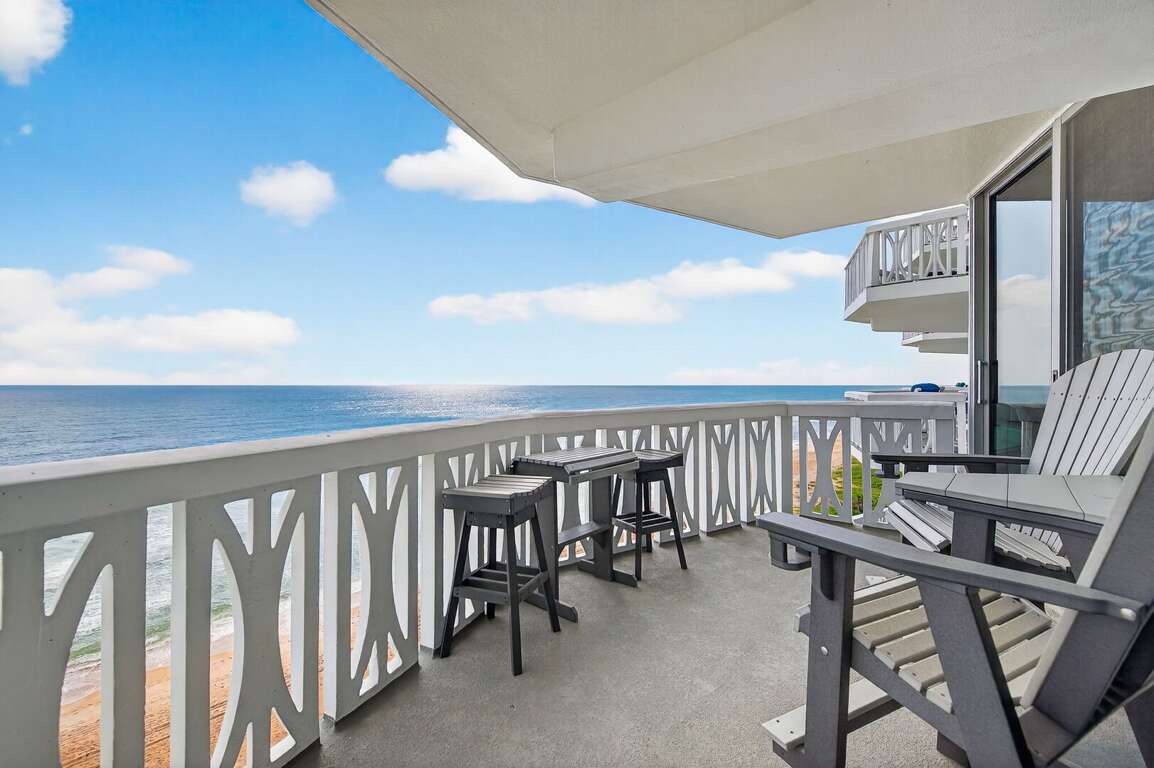 Relax and soak up ocean breezes on the balcony seating area, perfect for morning coffee and a sunrise. Relax and soak up ocean breezes on the balcony seating area, perfect for morning coffee and a sunrise.