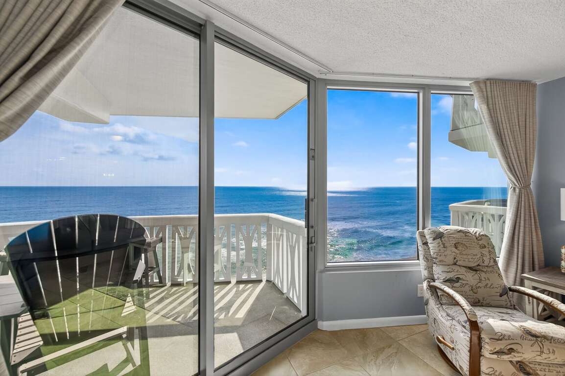 Step out from the oceanfront living room onto your private balcony, where fresh sea breezes and endless shoreline views await. Step out from the oceanfront living room onto your private balcony, where fresh sea breezes and endless shoreline views await.