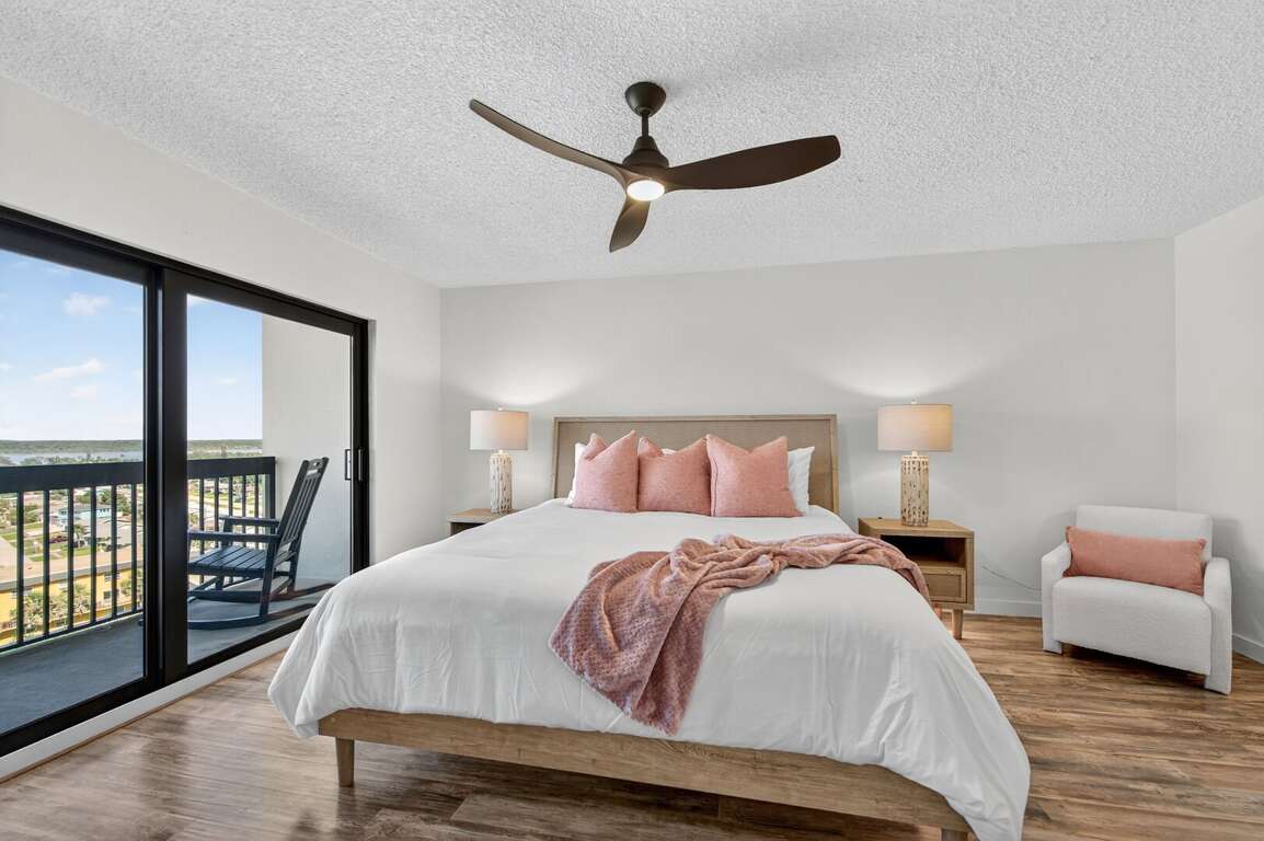 Rest easy on the king bed in the bedroom with direct access to a private balcony, great for morning coffee or sunset views Rest easy on the king bed in the bedroom with direct access to a private balcony, great for morning coffee or sunset views