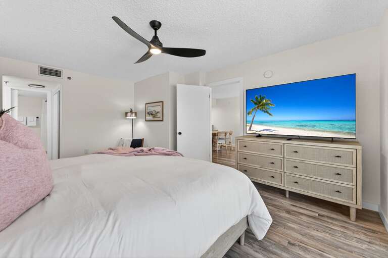 Unwind in bed while watching your favorite shows on the oversized smart TV Unwind in bed while watching your favorite shows on the oversized smart TV