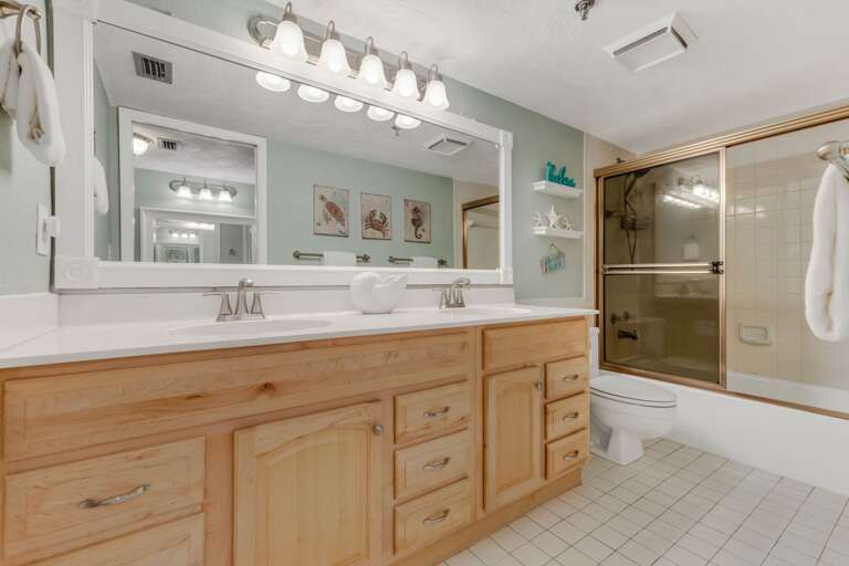 The ensuite master bathroom features a tub/shower combo and a large double vanity The ensuite master bathroom features a tub/shower combo and a large double vanity